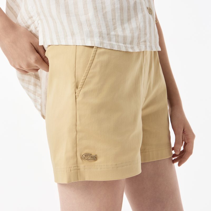 Женские короткие однотонные шорты Lacoste 5