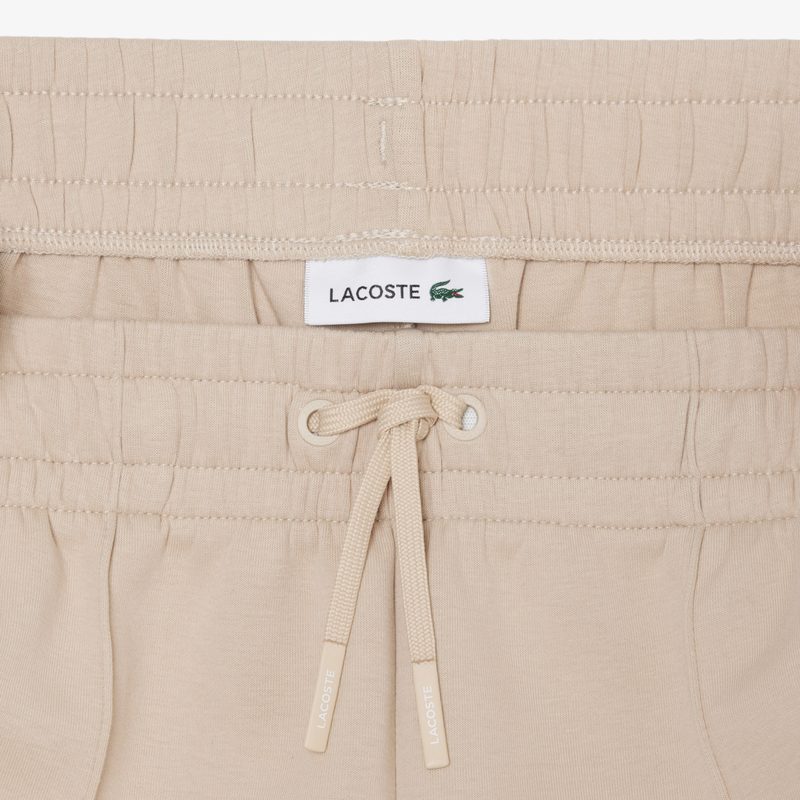 Женские хлопковые спортивные брюки-клёш Lacoste 5