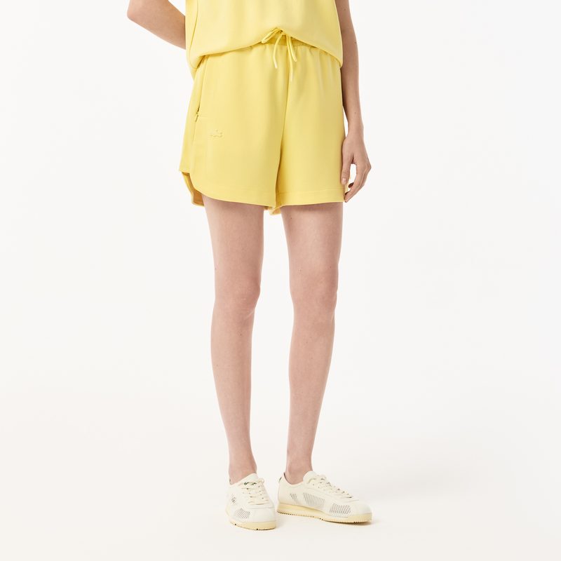 Женские спортивные шорты Lacoste с карманами 3