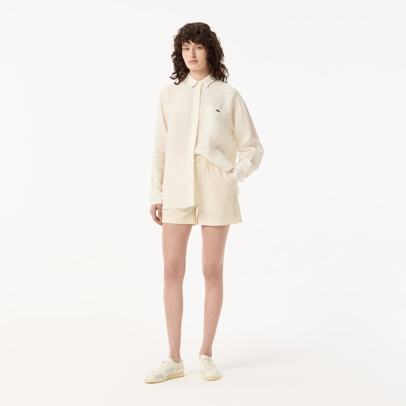 Женские короткие однотонные шорты Lacoste