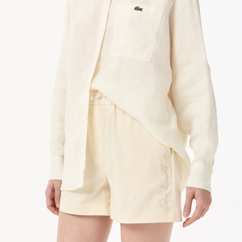 Женские короткие однотонные шорты Lacoste 4