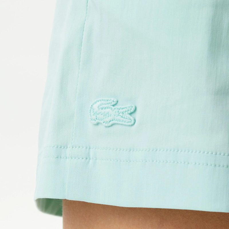 Женские короткие однотонные шорты Lacoste 5